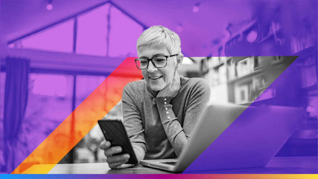 Person looking at their phone and smiling