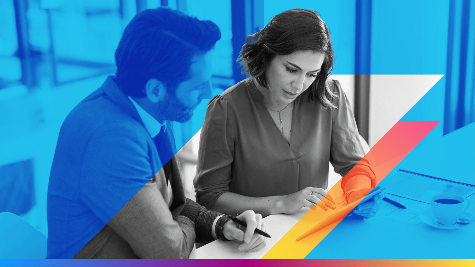 Image of two people looking at a tablet to promote the email marketing attribution article