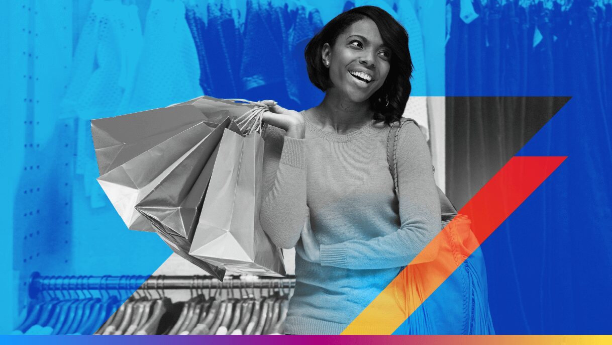 person carrying shopping bags in a retail store - featured image for AI holiday shopping trends article