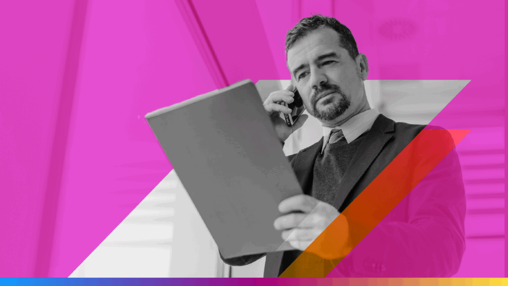 person talking on the phone with notebook to promote the adtech and martech convergence article